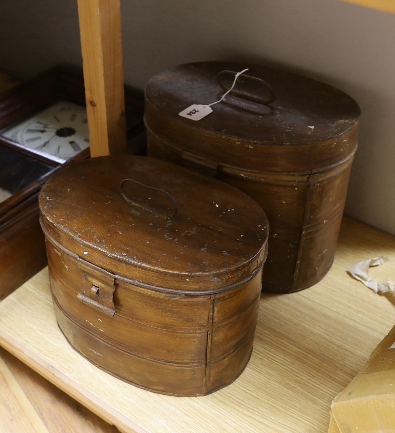 Two painted toleware hat boxes